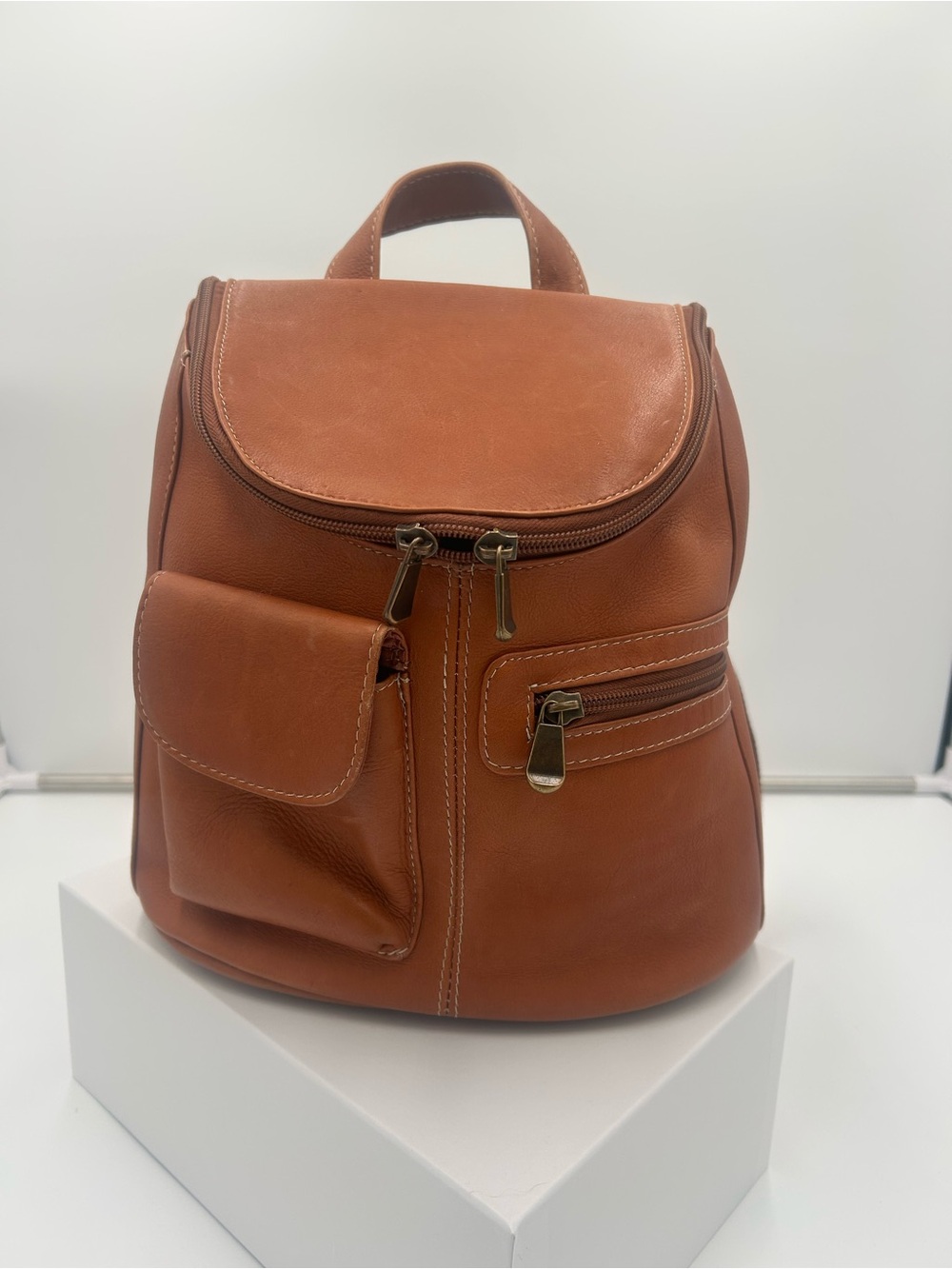 Sleek Tan Leather Backpack with Front Pockets